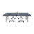 White Background Image: Full wide-angle view of the World Cup 25 table tennis table. Wheels, metal undercarriage, surface and net all visible.